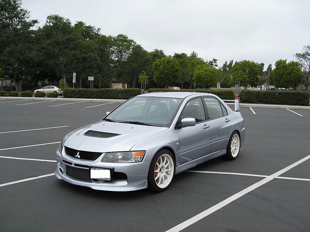 White wheels on a silver car - Mitsubishi Evo